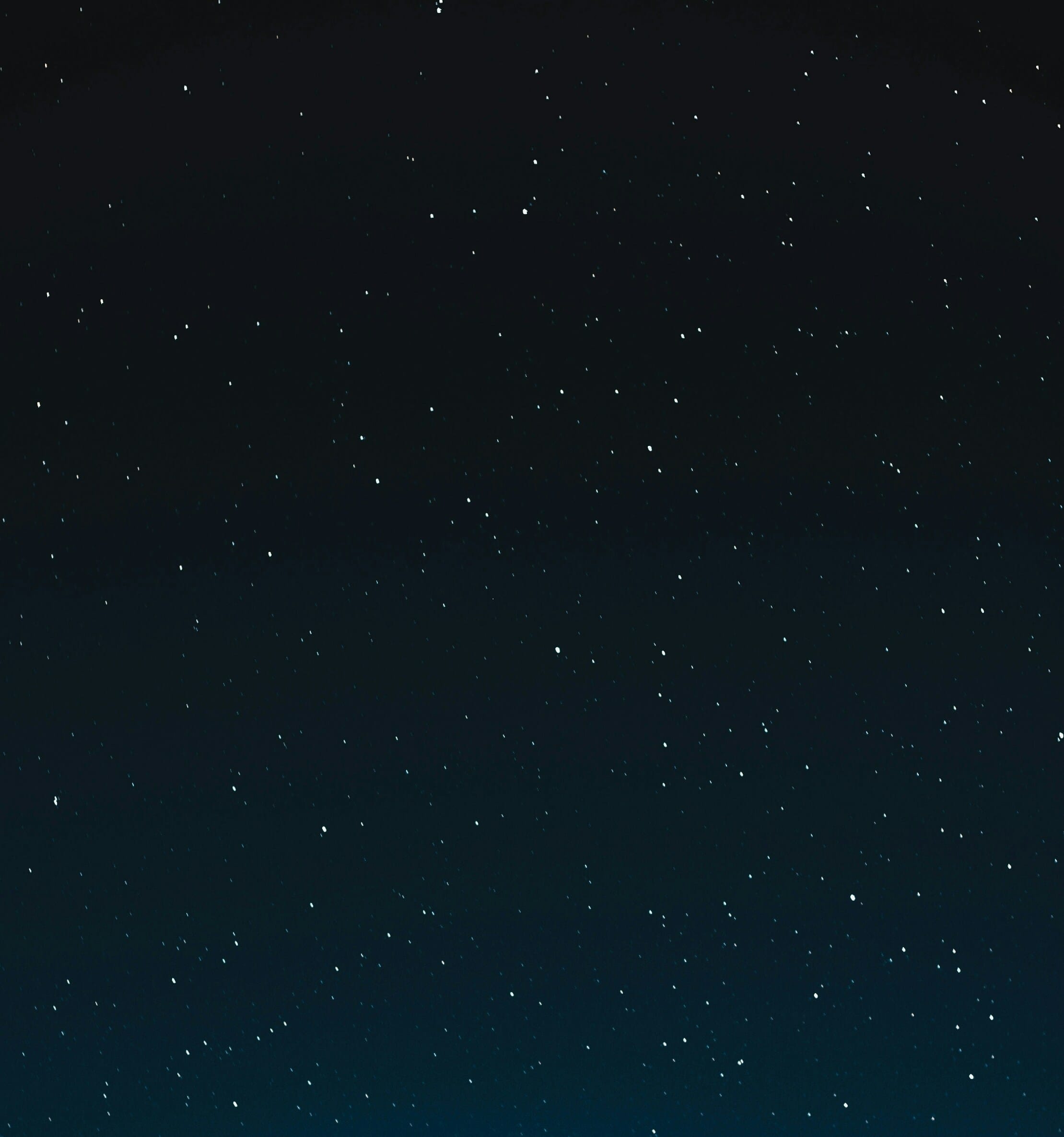 a night sky with stars and the moon